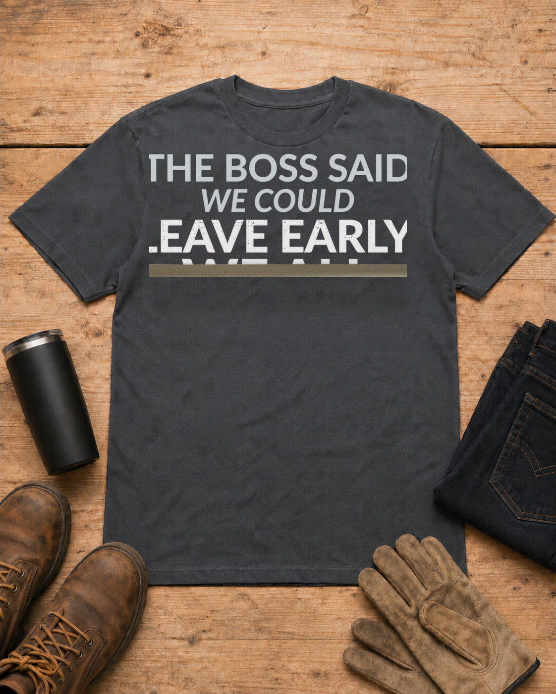 The Boss Said We Could Work Humor Shirt in Dark Heather workbench flat lay