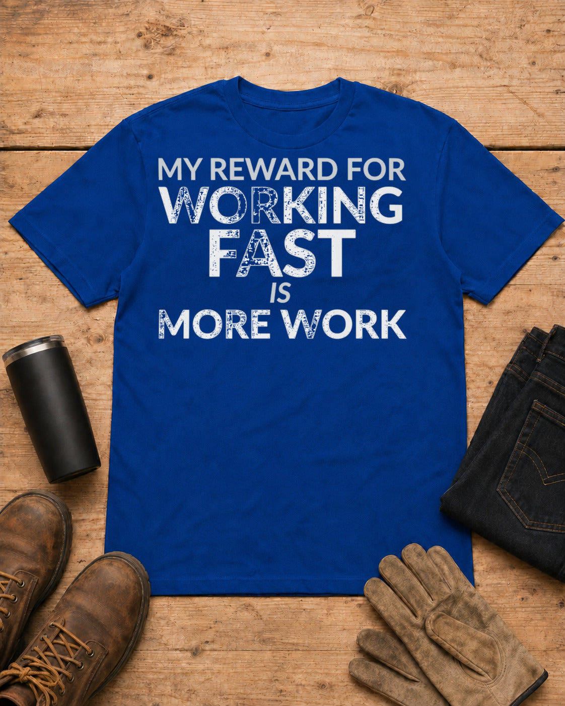 Working Fast Means More Work Funny Employee Shirt in Royal Blue workbench flat lay