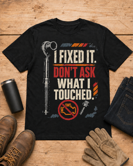 I Fixed It Don't Ask What I Touched Mechanic Shirt in Black workbench flat lay