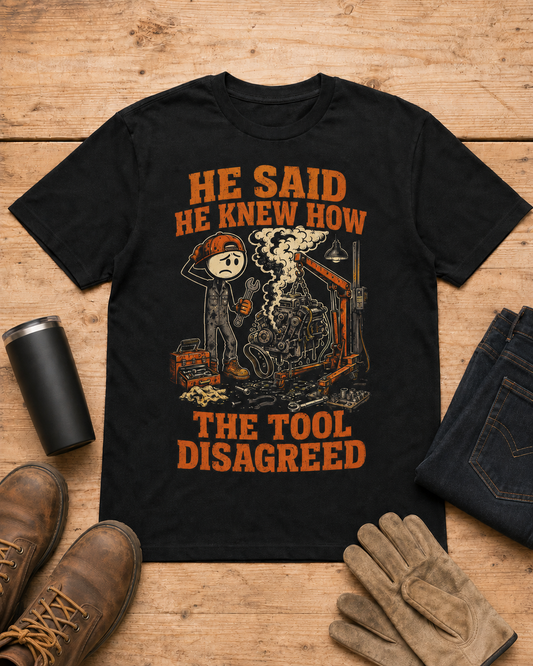 He Said He Knew How Tool Disagreed Work Humor Shirt in Black workbench flat lay