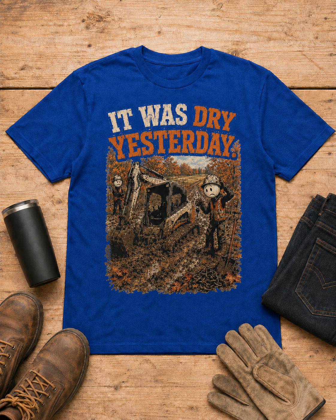 It Was Dry Yesterday. | Heavy Equipment T-Shirt in Royal Blue workbench flat lay