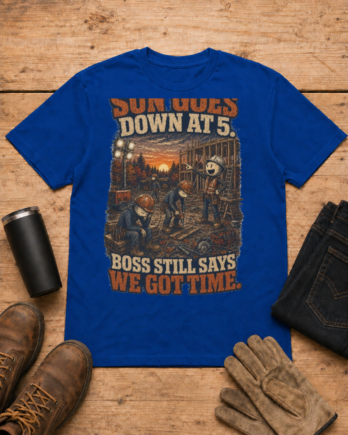 Sun Goes Down at 5. Boss Still Says We Got Time. | Construction T-Shirt in Royal Blue workbench flat lay