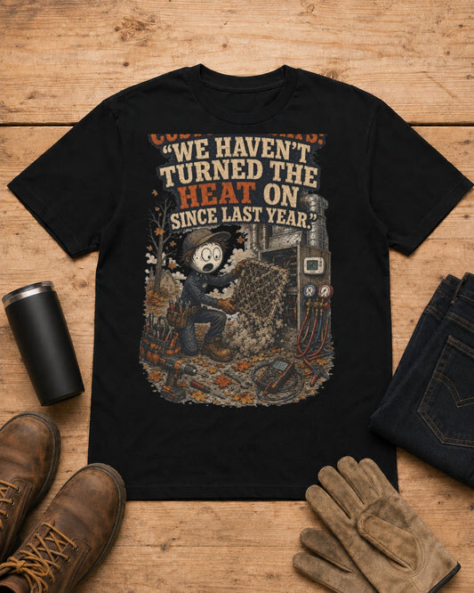Customer Says: “We Haven’t Turned the Heat On Since Last Year.” | HVAC T-Shirt in Black workbench flat lay