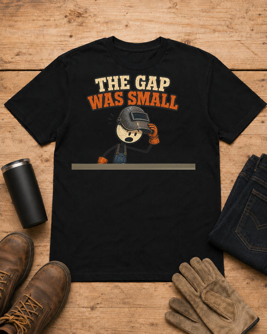 The Gap Was Small Funny Welder T-Shirt in Black workbench flat lay