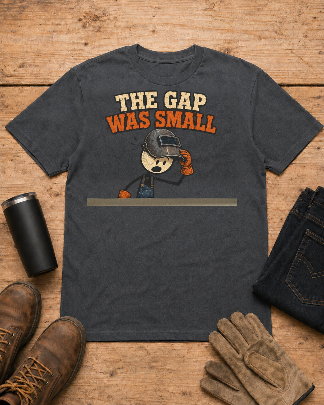 The Gap Was Small Funny Welder T-Shirt in Dark Heather workbench flat lay
