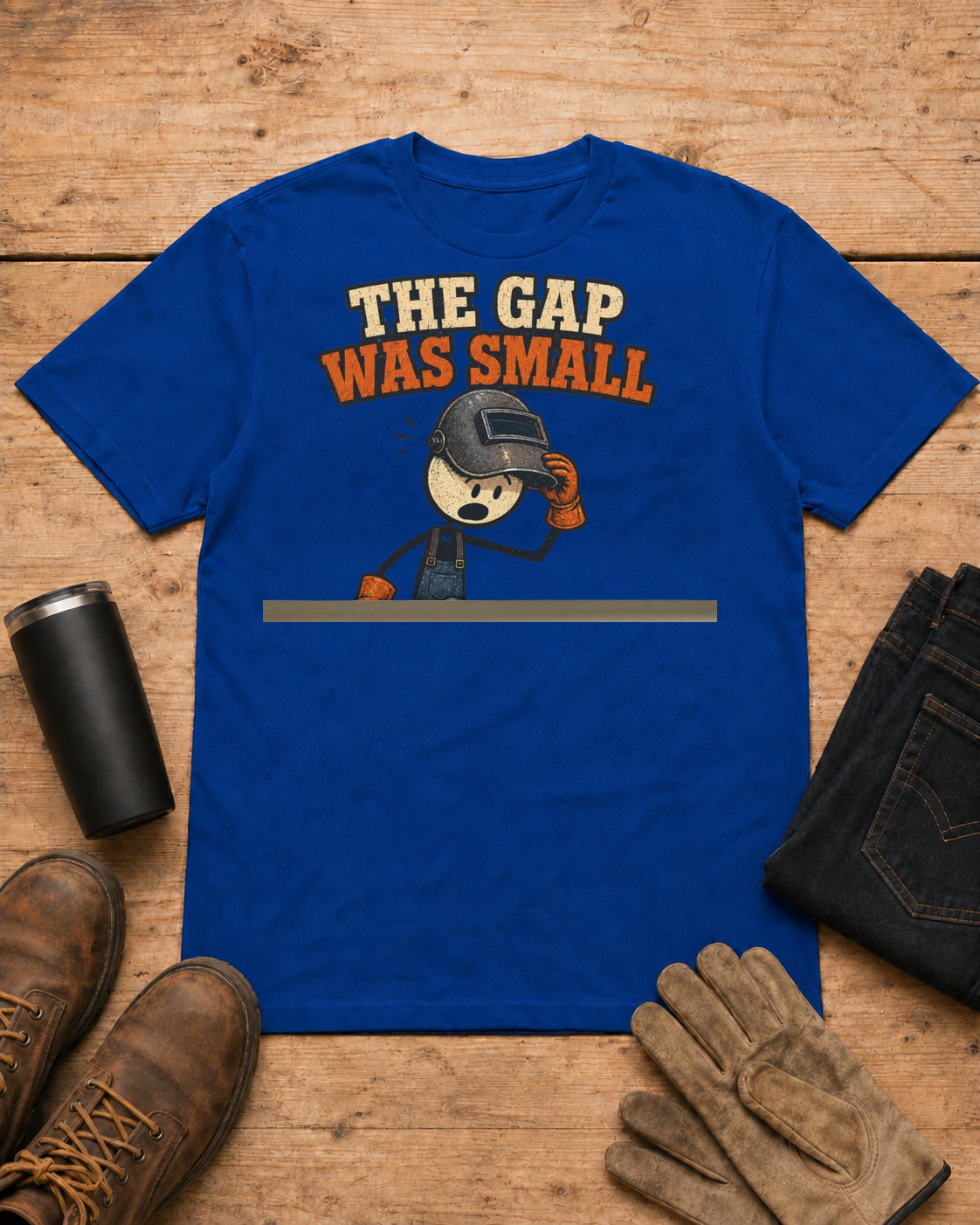 The Gap Was Small Funny Welder T-Shirt in Royal Blue workbench flat lay