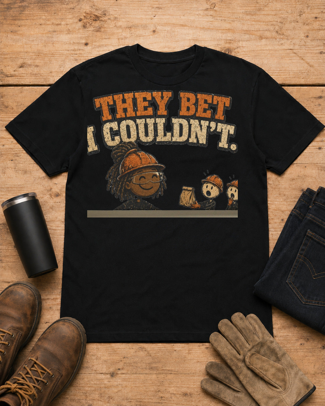 They Bet I Couldn't Funny Tradeswoman T-Shirt in Black workbench flat lay