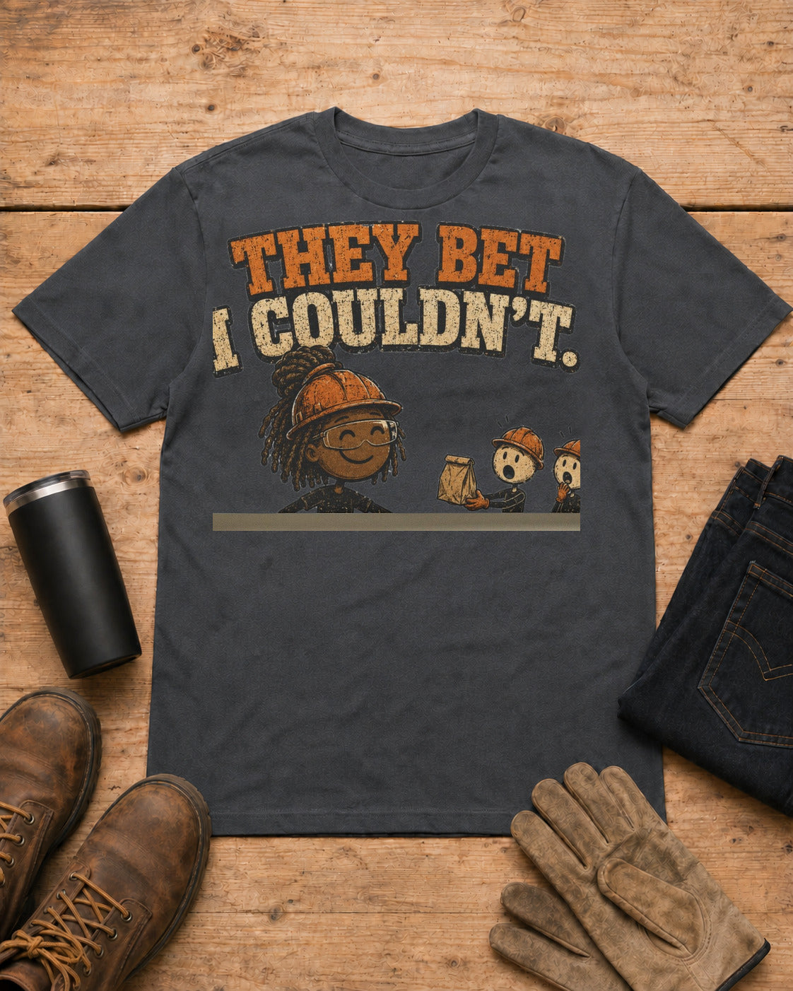 They Bet I Couldn't Funny Tradeswoman T-Shirt in Dark Heather workbench flat lay