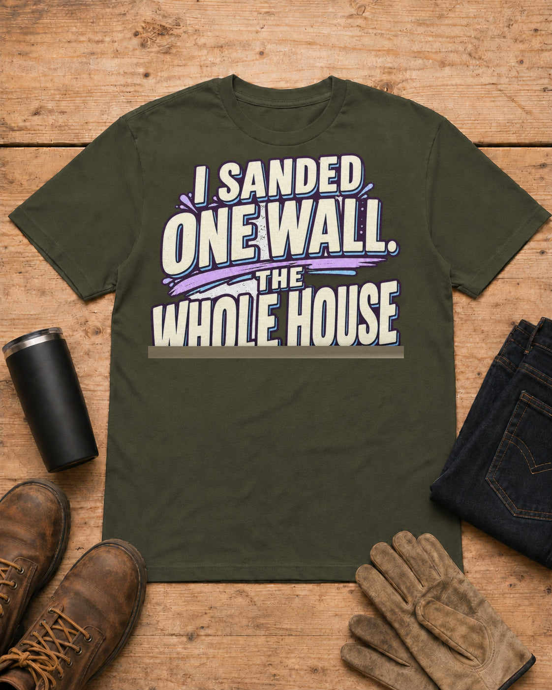 I Sanded One Wall. The Whole House Turned White. | Drywall T-Shirt in Military Green workbench flat lay