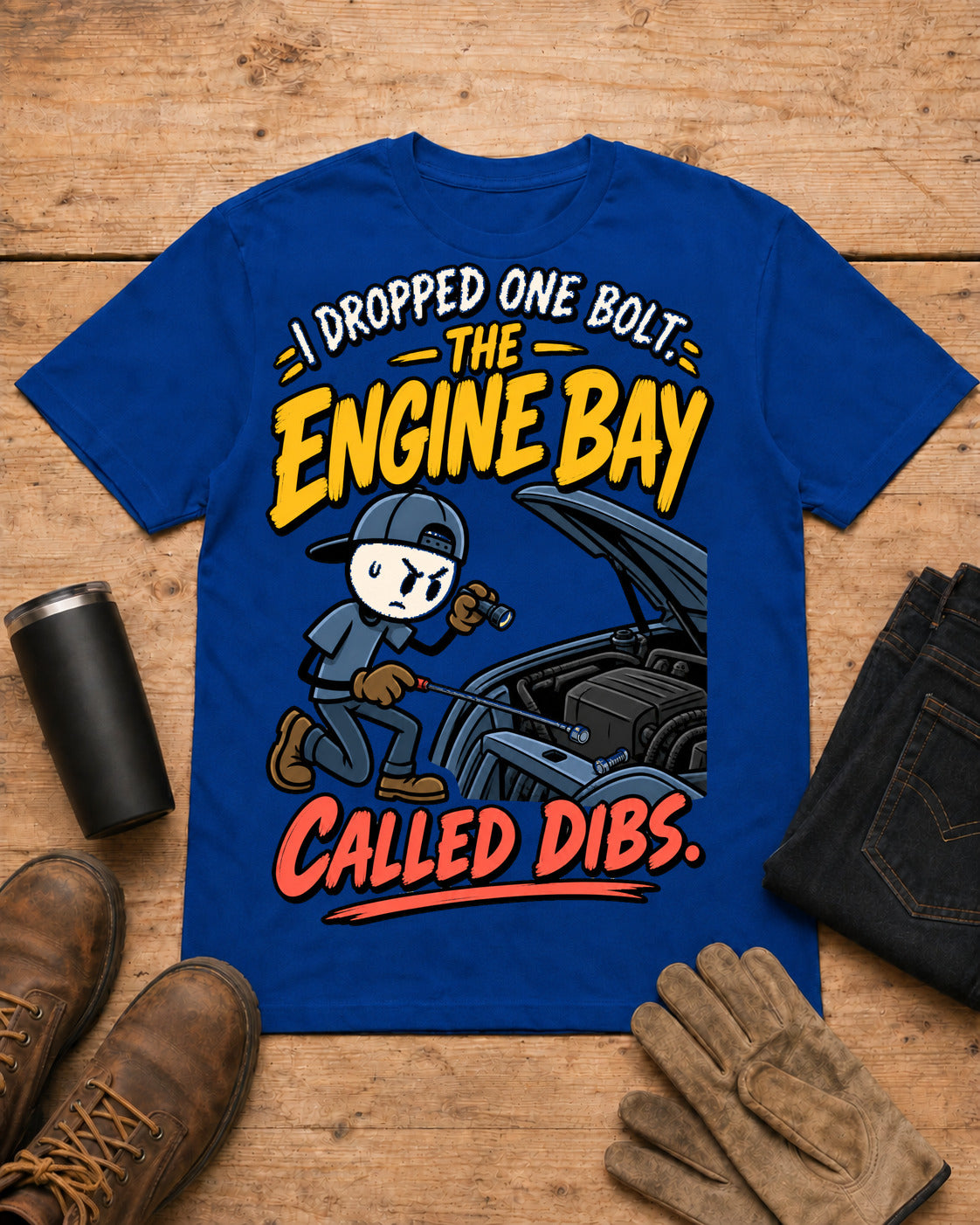I Dropped One Bolt. The Engine Bay Called Dibs. | Funny Mechanic T-Shirt in Royal Blue workbench flat lay