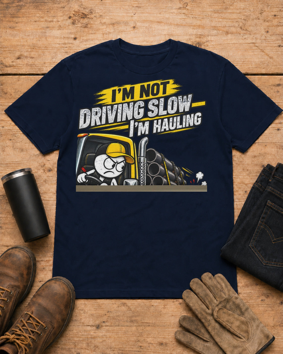 I’m Not Driving Slow—I’m Hauling 80,000 Lbs | Funny Truck Driver T-Shirt in Navy workbench flat lay