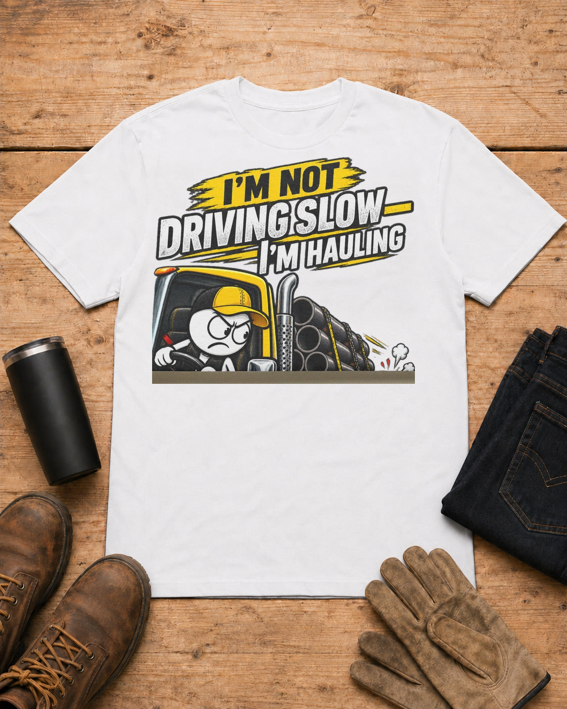I’m Not Driving Slow—I’m Hauling 80,000 Lbs | Funny Truck Driver T-Shirt in White workbench flat lay