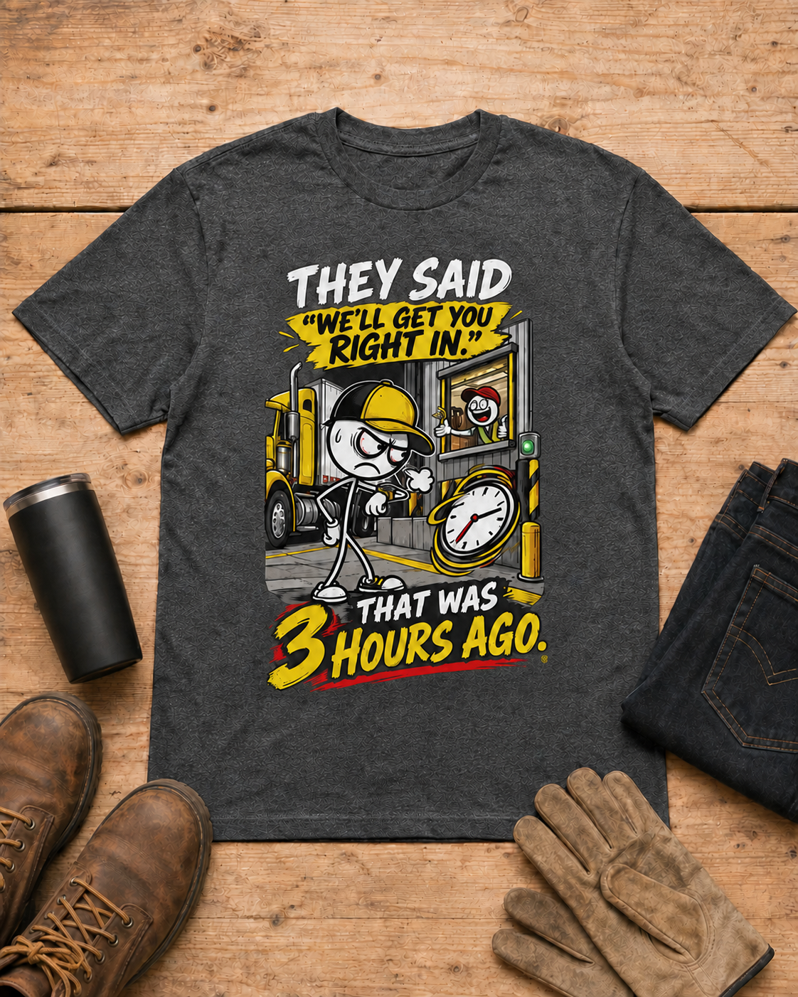They Said “We’ll Get You Right In.” That Was 3 Hours Ago. | Funny Truck Driver T-Shirt in Dark Heather workbench flat lay