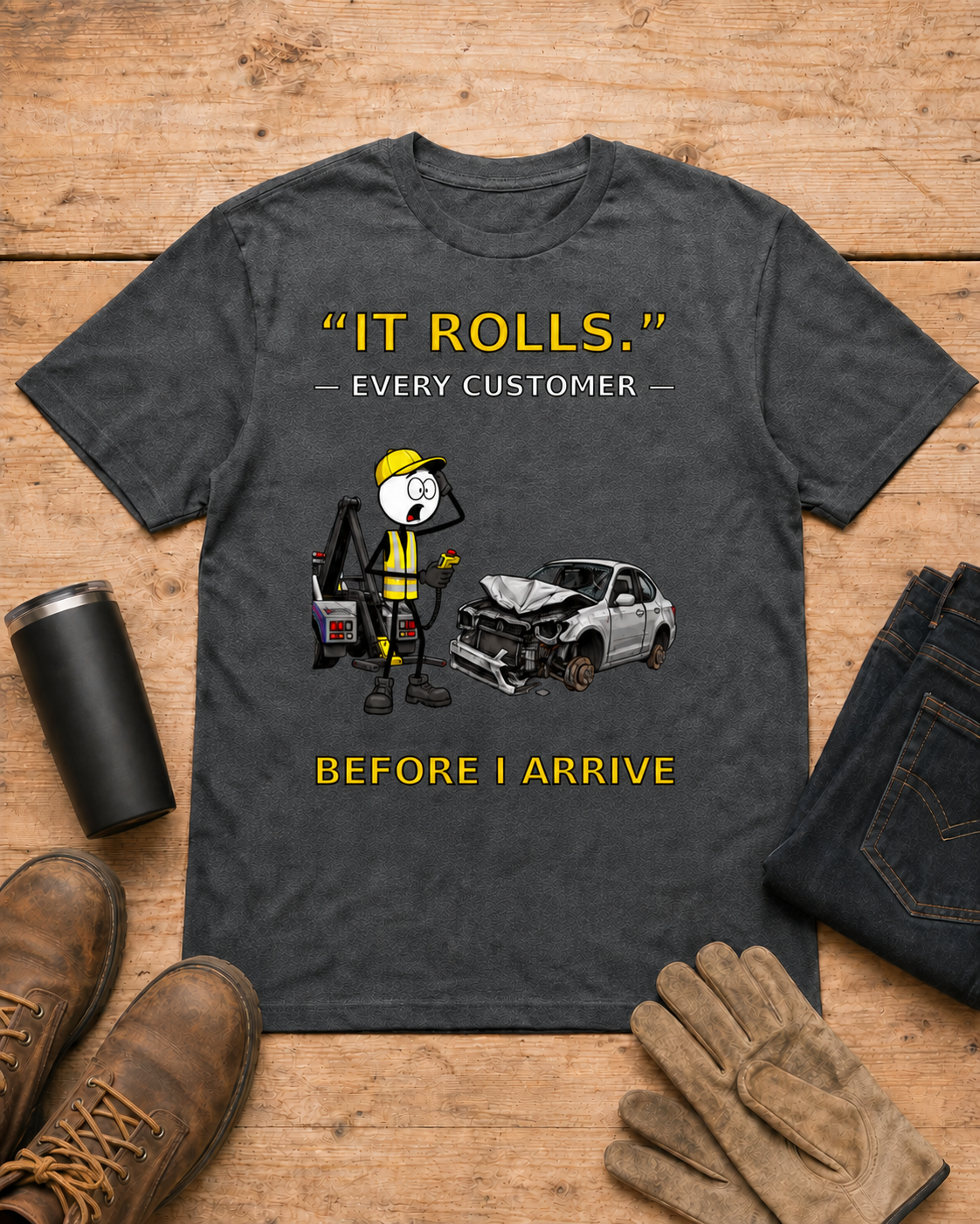 “It Rolls.” — Every Customer Before I Arrive | Tow Truck Driver T-Shirt in Dark Heather workbench flat lay