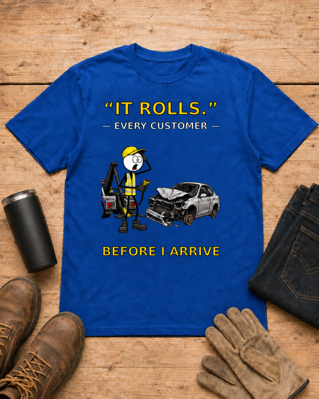“It Rolls.” — Every Customer Before I Arrive | Tow Truck Driver T-Shirt in Royal Blue workbench flat lay