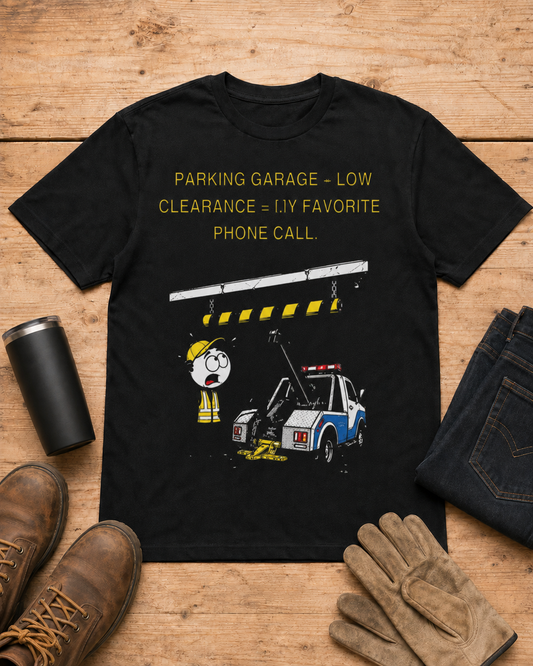 Parking Garage Low Clearance Tow Truck Driver T-Shirt in Black workbench flat lay