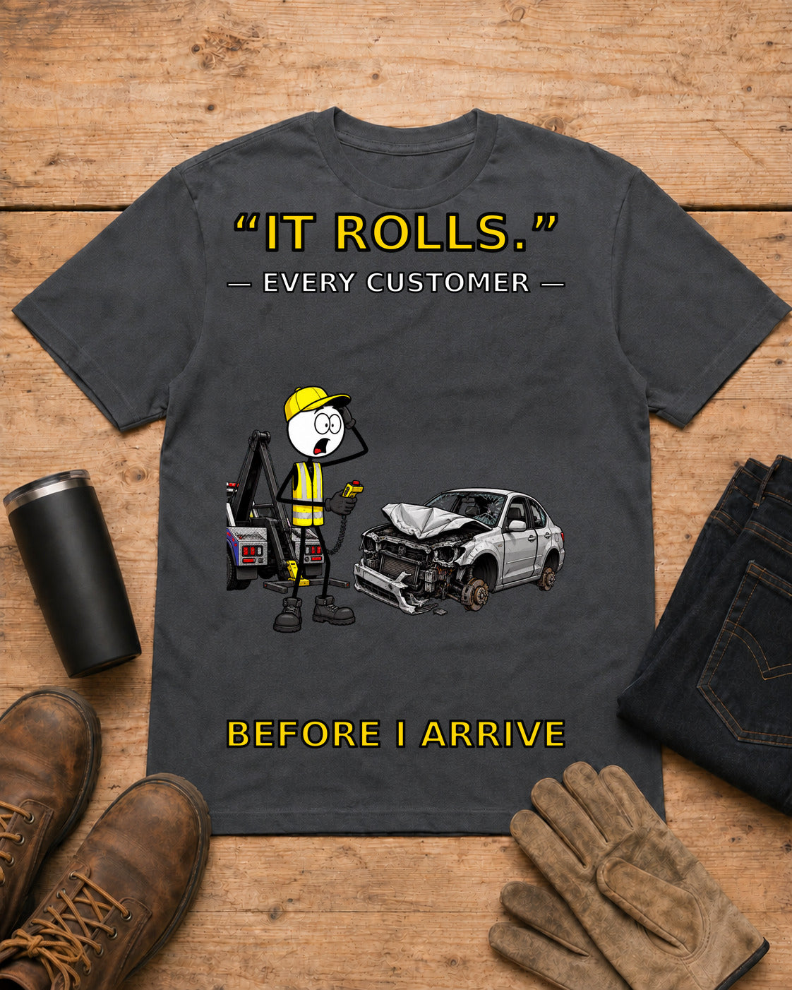 It Rolls Every Customer Before I Arrive Tow Truck T-Shirt in Dark Heather workbench flat lay